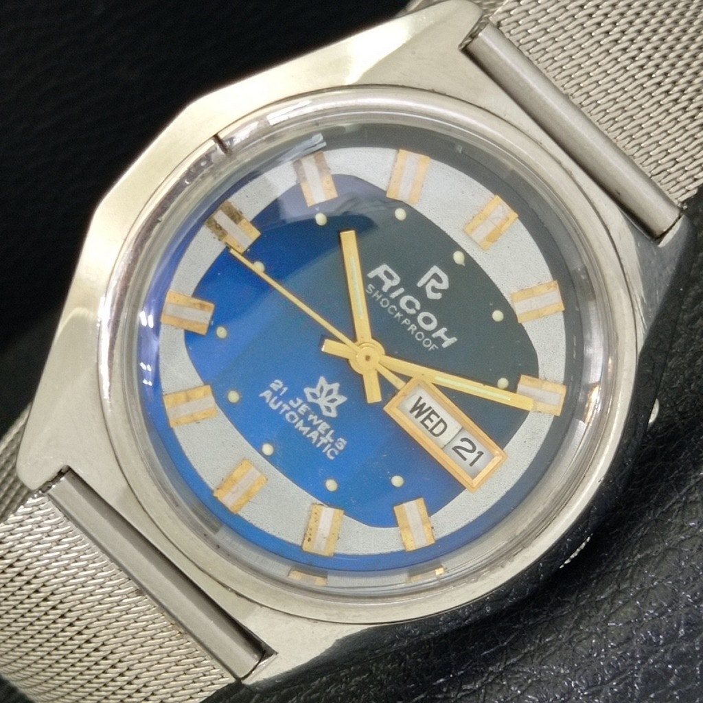 Vintage 1986 Ricoh Automatic Mens Silver Watch WDaydate  Blue Accents